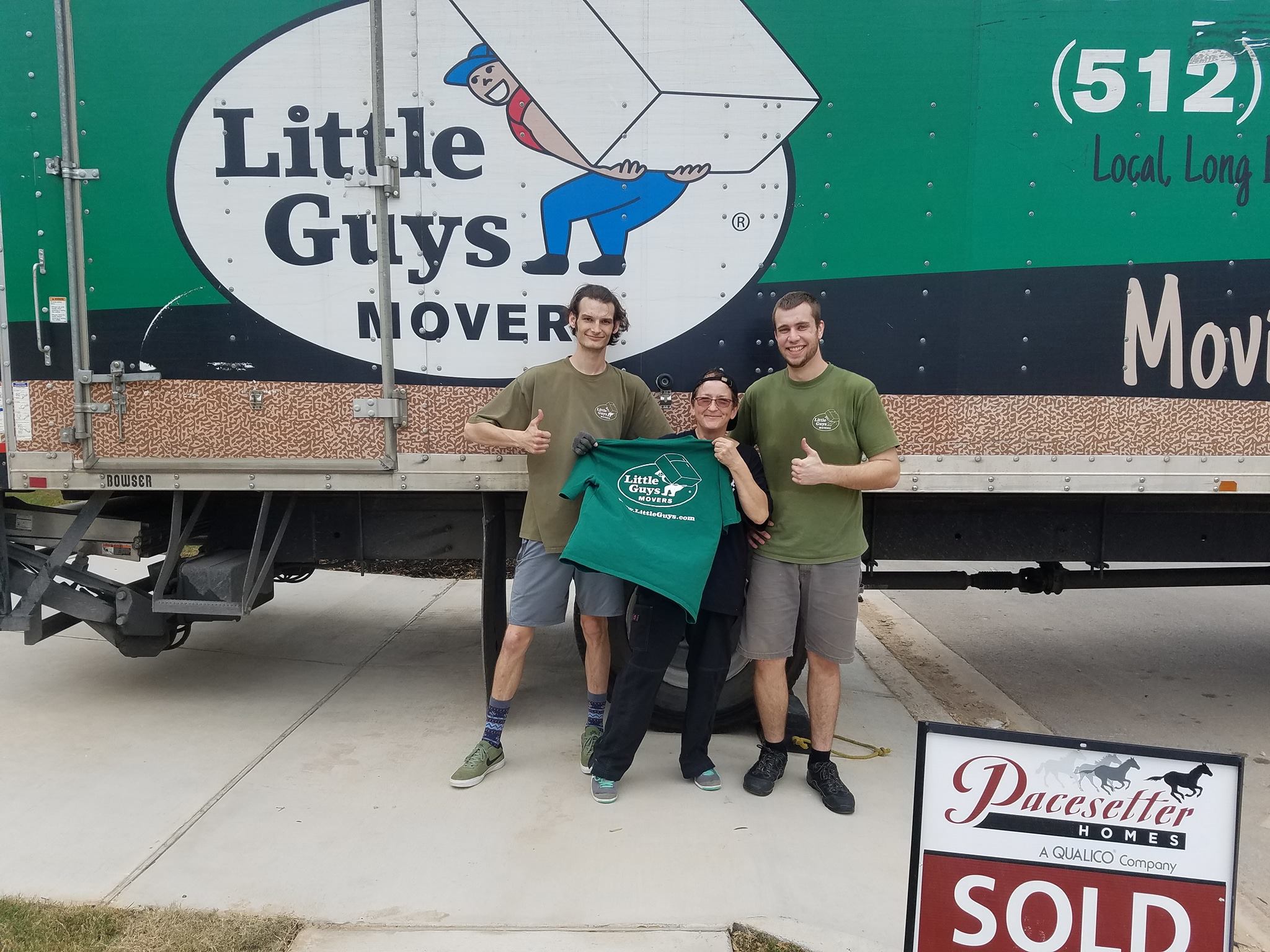 san marcos professional moving little guys movers with customer in front of truck