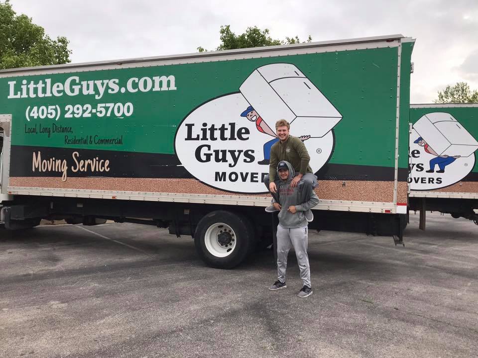 norman jobs two movers in front of truck
