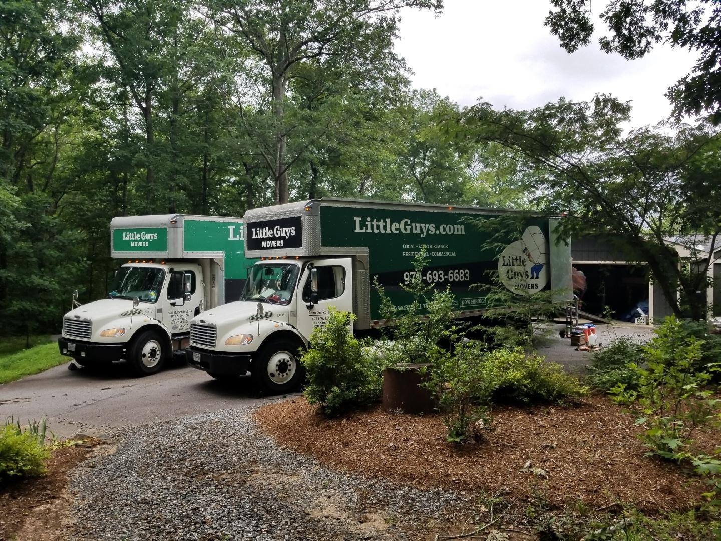 college station moving company trucks outside residential home