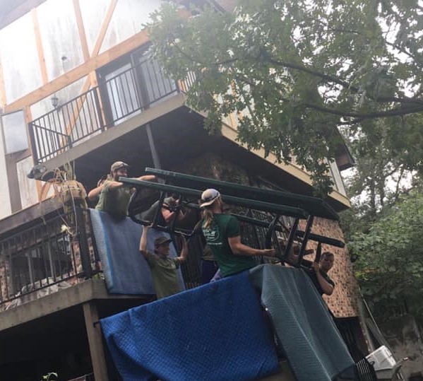 san marcos moving company movers lifting picnic table