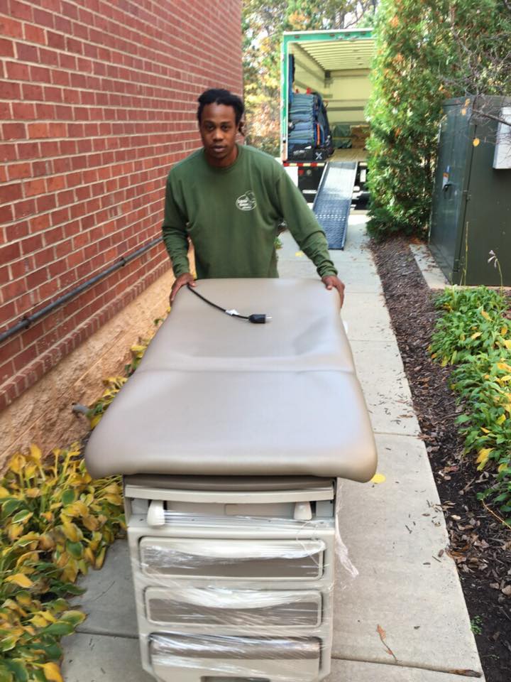 raleigh corporate movers moving a doctor's table