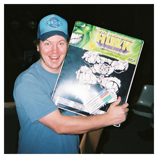 Little Guys Mover "lifer" Eric Eisenmann smiles big as he holds a new hulk toy up for the camera
